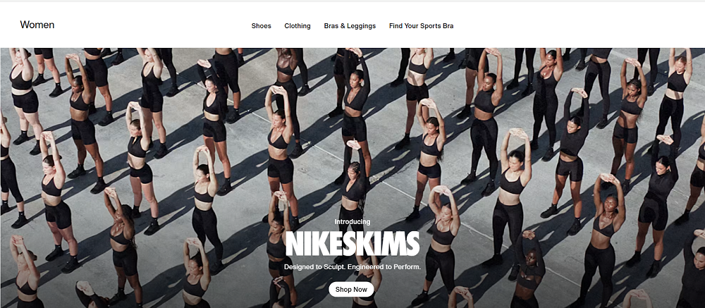 Group of women wearing black athletic outfits stretching outdoors, showcasing the Nike Skims women’s collection designed for performance and comfort.